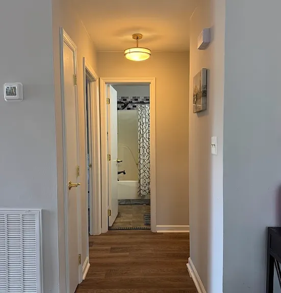 Hallway leading to the 2 full bathrooms/bedrooms