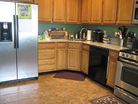 Large kitchen with plenty of counter and cabinet storage. Newer stainless appliances and granite cou