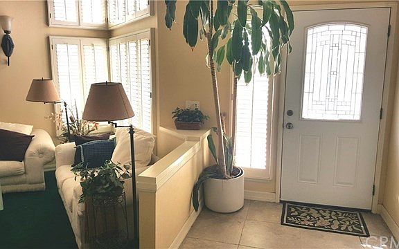 A beveled glass door invites you into the foyer and formal living areas