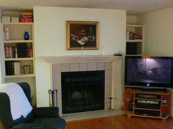 Real wood burning fireplace with built-in bookshelves