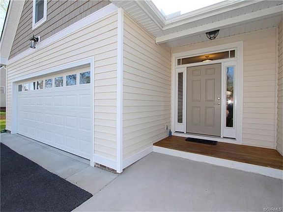 Well designed home features a Covered Entry and low maintenance Vinyl Siding