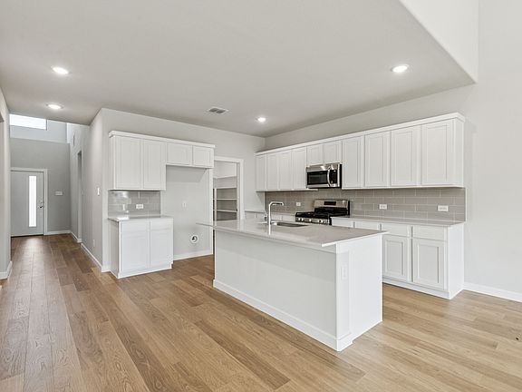 Kitchen in the Winters home plan by Trophy Signature Homes - REPRESENTATIVE PHOTO
