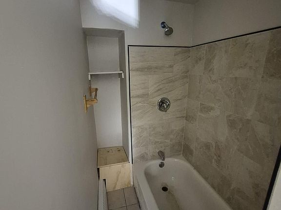 2nd level bath has a very narrow entry to shower.
