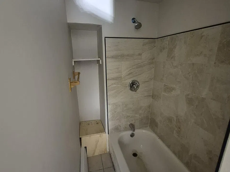 2nd level bath has a very narrow entry to shower.