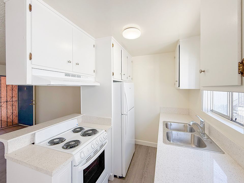 Kitchen features a new electric stove, fridge, sink with garbage disposal!