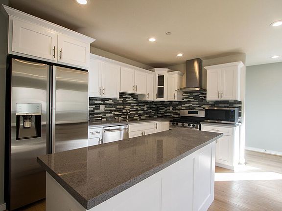 Kitchen w/Samsung Suite Of Appliances & Quartz Counters