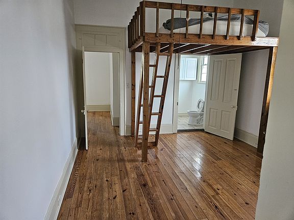 VIEW OF 1st BEDROOM WITH LOFT
LEADS INTO FRONT ENTRANCE ROOM
