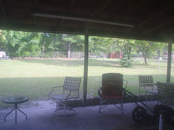 back covered patio and huge fenced back yard