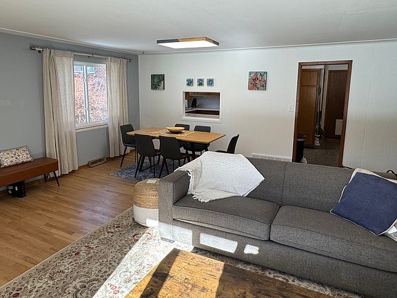 View from living to dining area and entry to kitchen