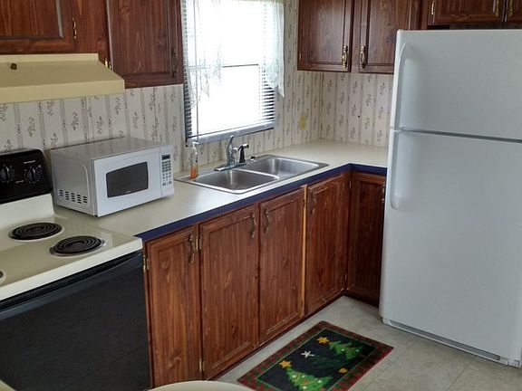 Kitchen with included fridge and microwave