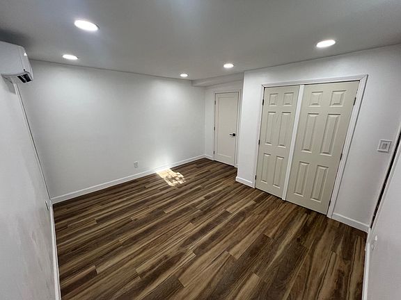 Second bedroom has double door closet, modern and minimalistic.
