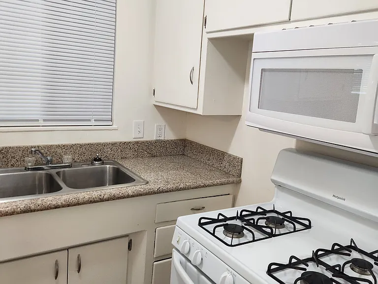 Kitchen with stove and microwave