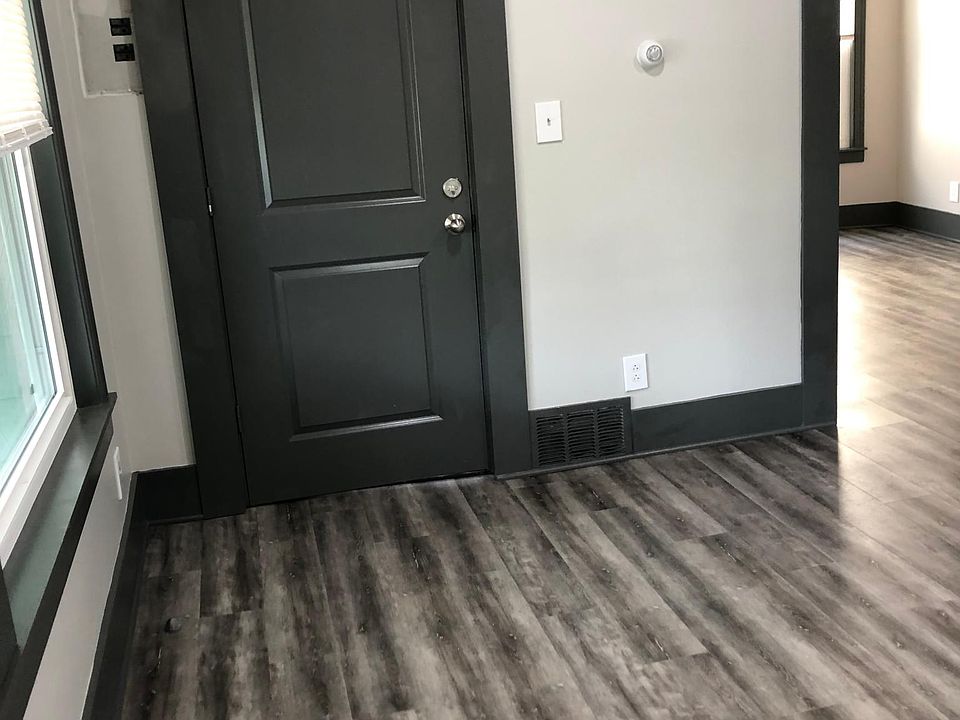 Door into open space living room & kitchen area.