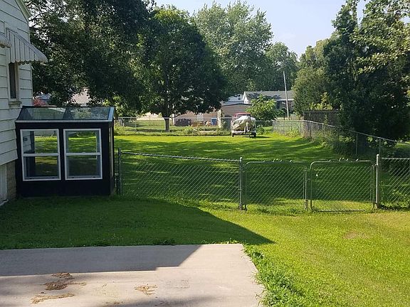 Large chain link fenced back yard