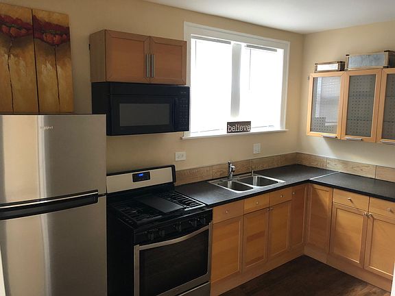 New stainless steel appliances and hardwood floors.