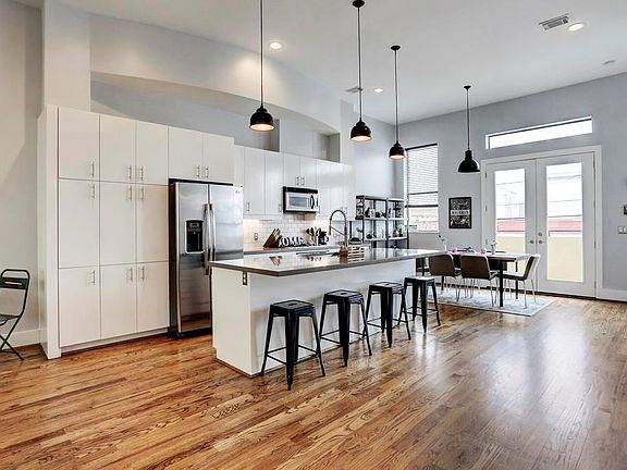 Gleaming hardwoods throughout 2nd story living. Stainless appliances, quartz island and abundance of cabinetry.