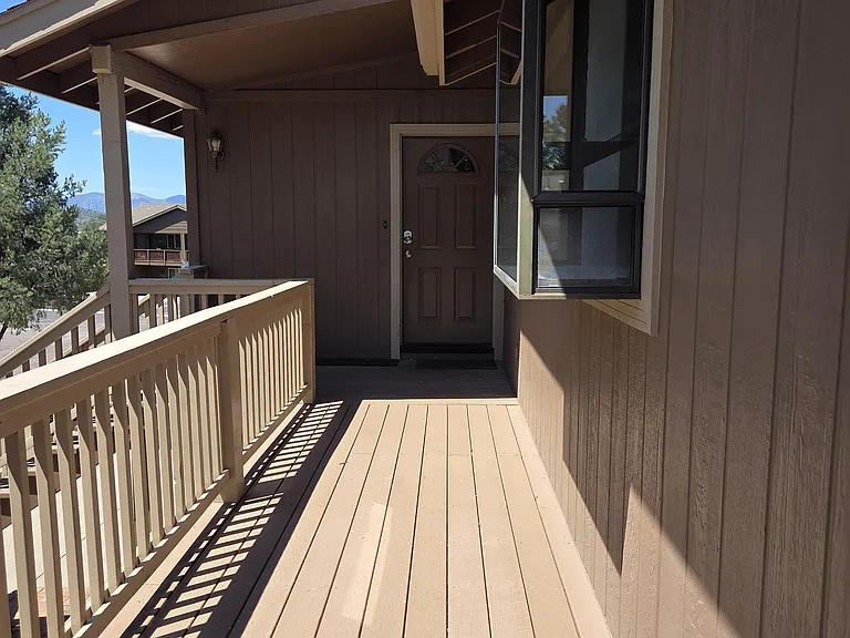 View of the front door and the window garden from the deck.