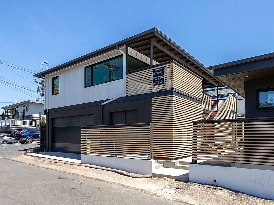 Exterior of property with a 2 car garage.