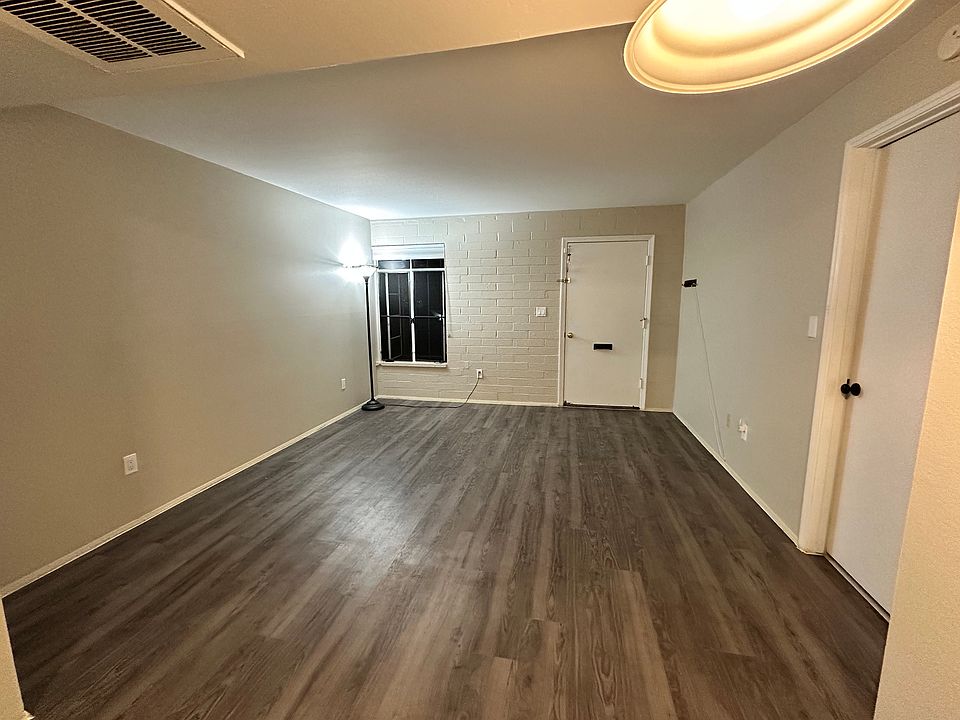 Newly installed easy maintenance vinyl plank floor, covering the living room, dining area and kitchen.