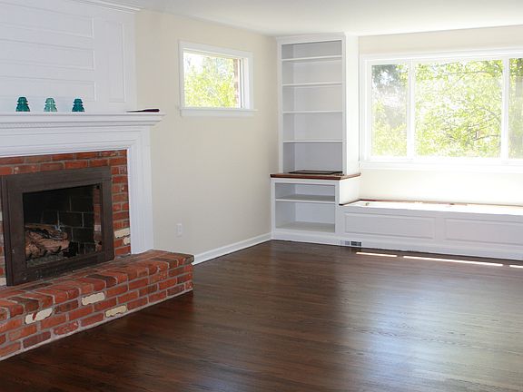 Beautiful living room with gas fireplace and built-in bookca
