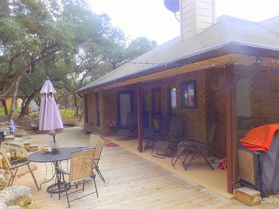 Back patio and deck. All patio furniture and grill remain