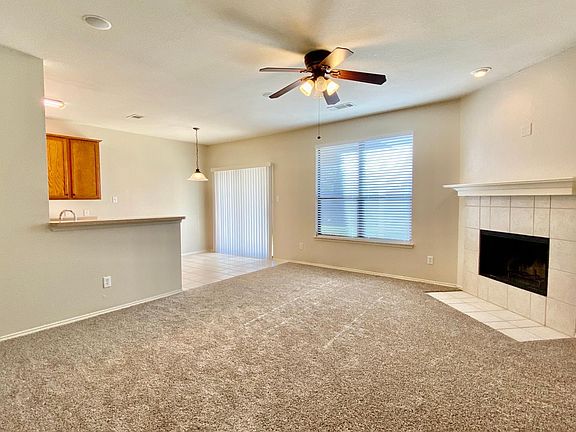 Living room, open concept with fireplace.