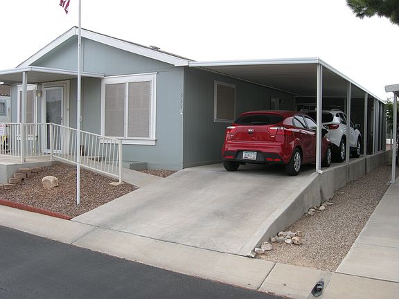 Front of house with carport