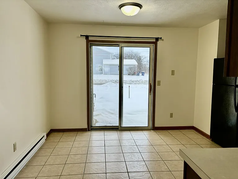 Kitchen with slider leading to patio.