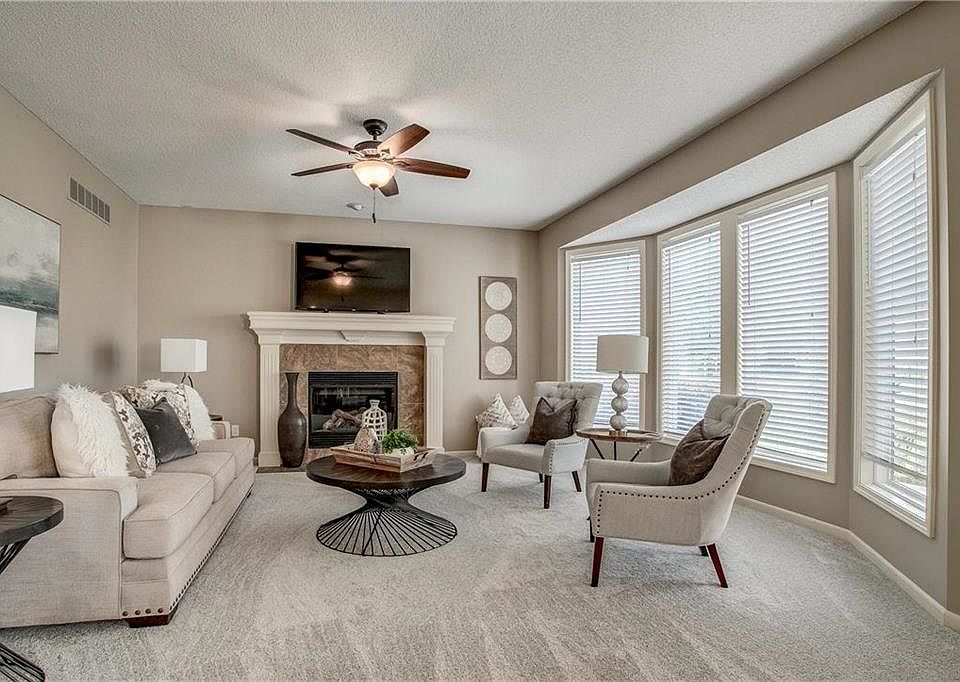 Absolutely Beautiful Interior! NEW CARPET, NEW PAINT, NEW LIGHTING, gleaming hardwood floors makes this home feel BRAND NEW!