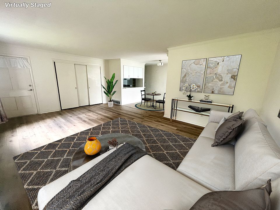 Living room, adjacent to front door entry