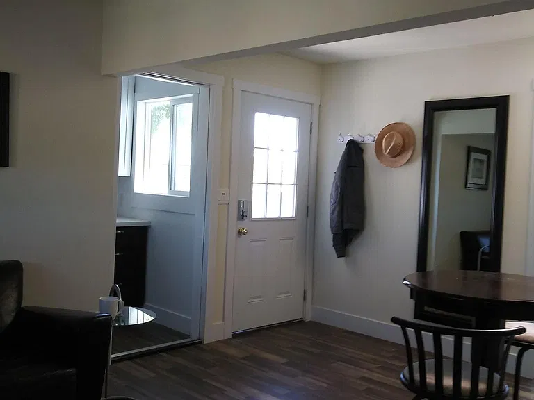 living room looking towards front and kitchen doors