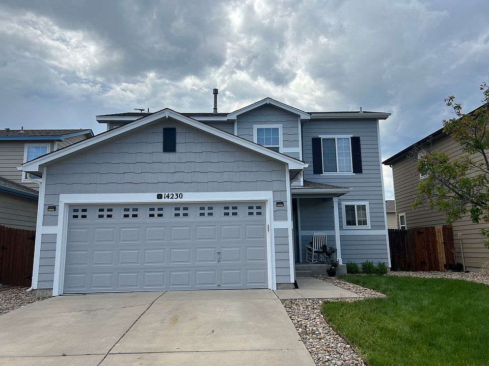 Beautifully-maintained 2-story home with fenced yard, in-ground sprinkler system, and direct access to I-25 and the USAF.
