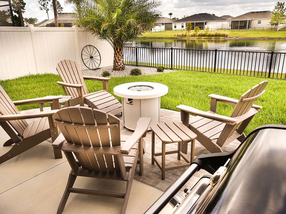 Best Outdoor area ever!! Fire pit table and Weber barbecue