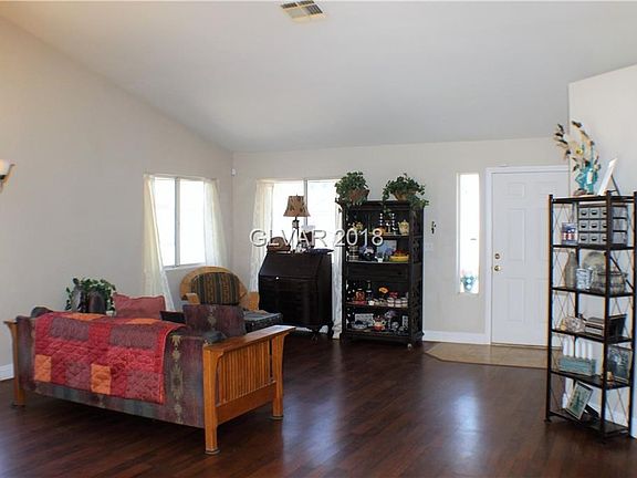 LIVING ROOM ACCENTED WITH WOOD LAMINATE FLOORING!