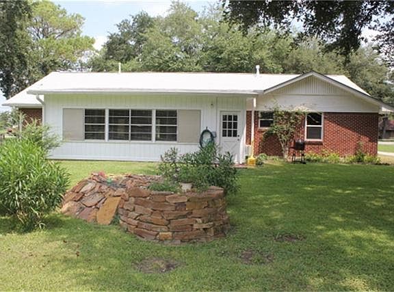 Back view of home and view of pond.New roof in 2008