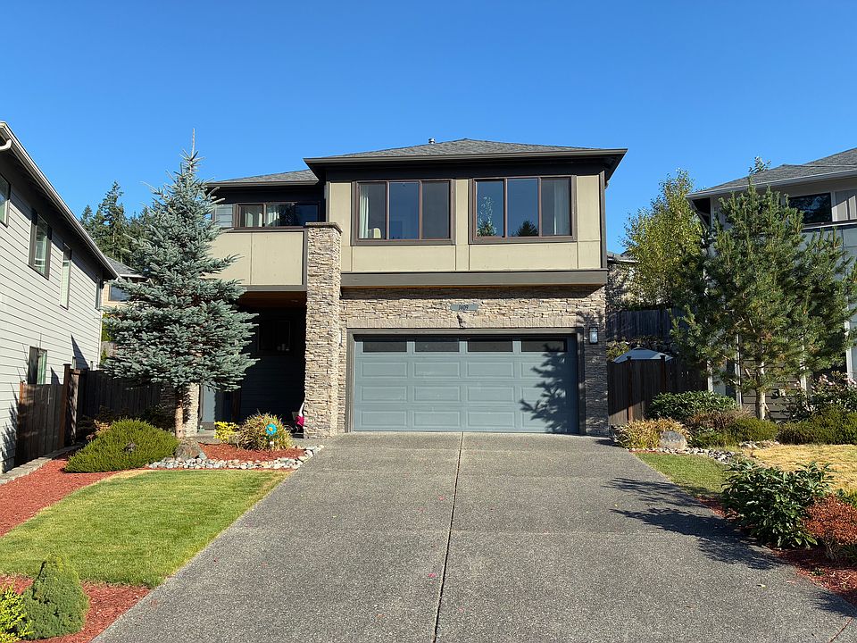 A landscaped front yard with a welcoming front door.