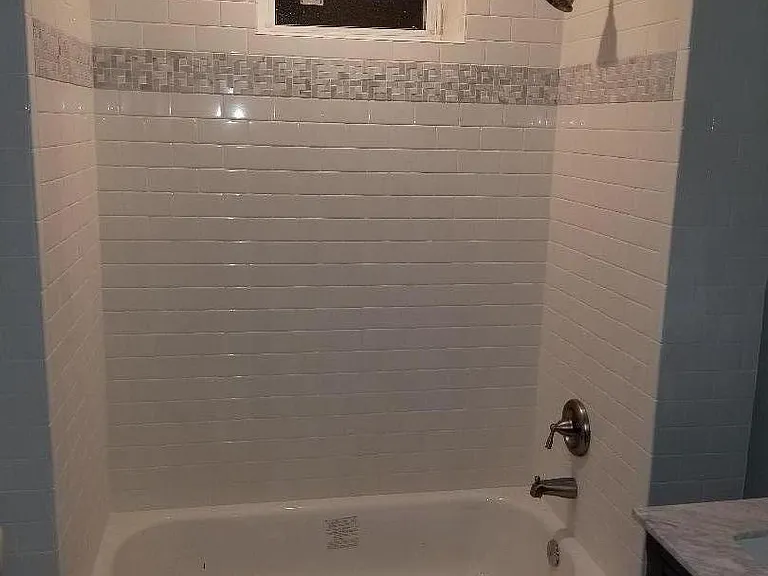 Bathroom with marble accent.