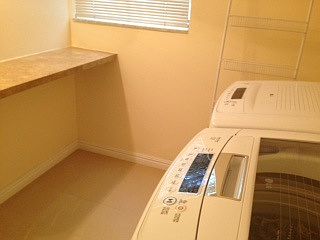 Laundry room by kitchen