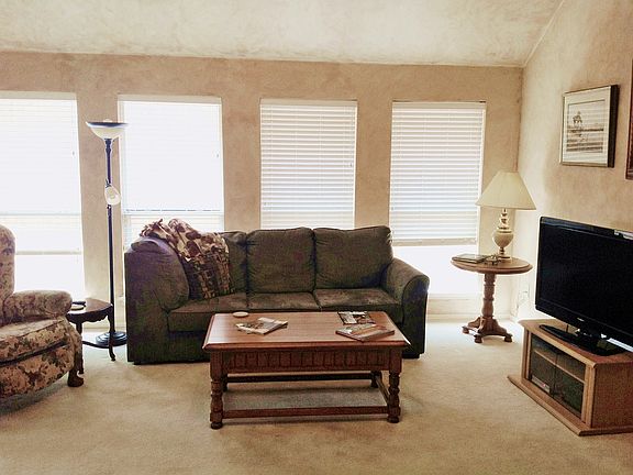 Large windows and high ceilings let in natural light