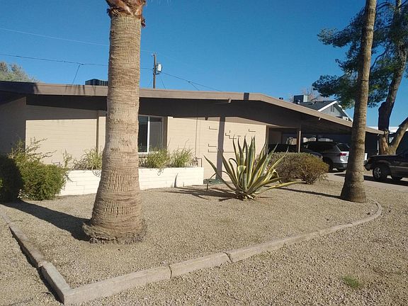 Street View. No garage, 2 car carport. Low maintenance, low water plants. Drip system is installed and operational.