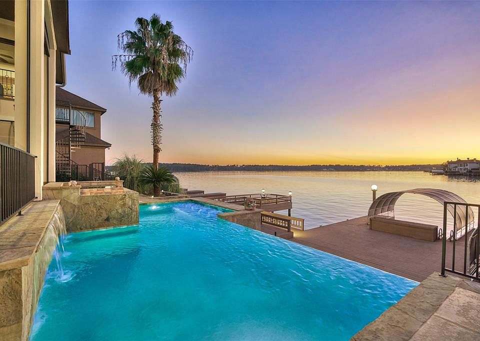 Beautiful waterfront home in the exclusive gated golf community of Bentwater. This beautiful infinity edge pool offers 3 waterfall features and spa. Is currently a chlorine pool but can easily be converted to saltwater if desired.