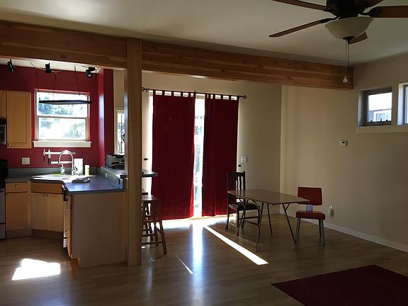 Back sliding door to large, fenced back yard with southern exposure - great for garden beds or dog.