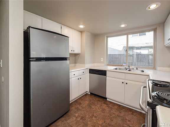 The kitchen features stainless steel appliances, and has been lightly remodeled.  The flush-mounted ceiling lighting combined wi