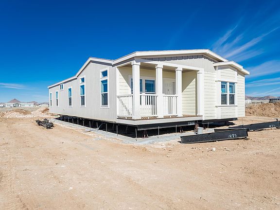 Nice covered deck, 2x6 construction, upgraded insulation, Low-E vinyl windows.  Ground set with concrete block foundation.