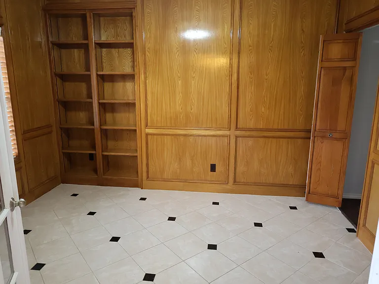 Study right beside the front entry. Built-in book shelves.