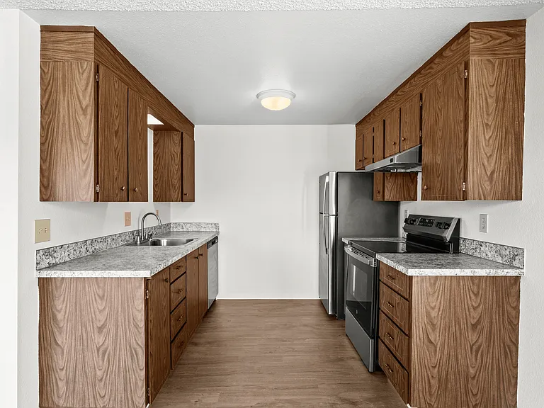 Functional kitchen with ample cabinet storage and workspace Functional kitchen with ample cabinet storage and workspace