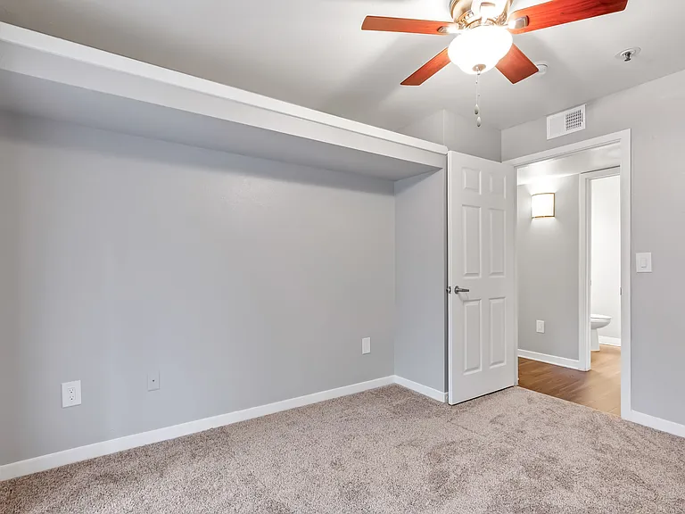 A Bedroom at The Buttes Apartment Homes in Loveland, CO