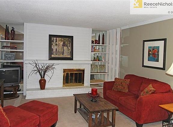 Living Room with Brick Fireplace