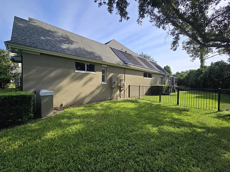 Large fenced in side and back yard