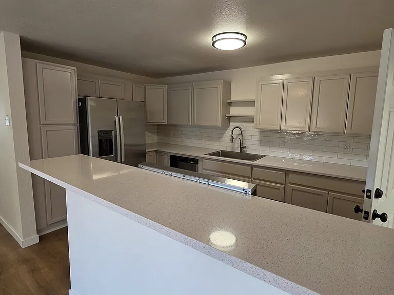 Newly updated kitchen has plenty of storage and new appliances